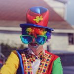 shallow focus photography of human wearing clowns costume